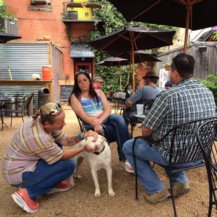 a group of people and a dog