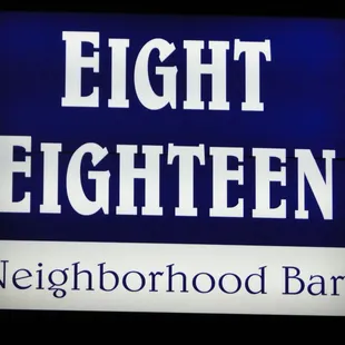 a sign for eight eighteen neighborhood bar