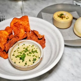 Spot prawn jalapeño dip with chips and a house made bolillo bread with ancho chili crab butter