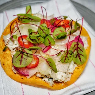 Dungeness crab tostada with pepper, hoja santa aioli, winter radish, fennel and herbs