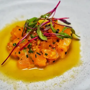 Golden beet tartare with black lime, fried quinoa with a celery serrano leche de tigre