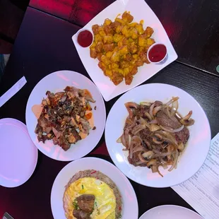 Island fried rice, rib eye, dynamite chicken and loaded cheese and bacon tots