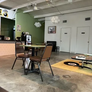 a table and chairs in a coffeehouse