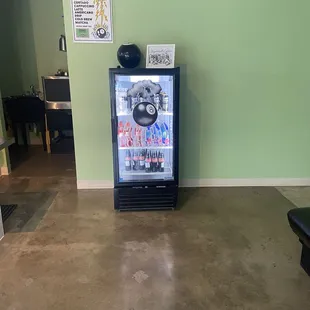 a vending machine in a green room