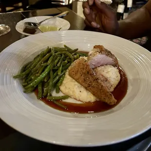 Duck breast cooked perfectly with cheddar grits and green beans. A delicious sauce complimented the breast esp when paired with a good red!