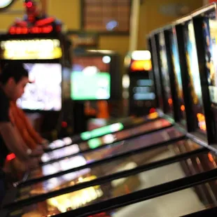 a row of pinball machines