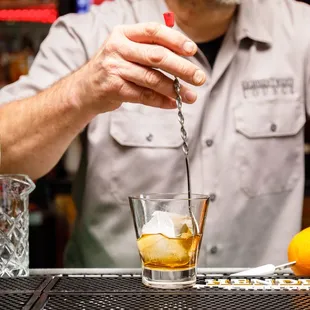 a bartender mixing a drink