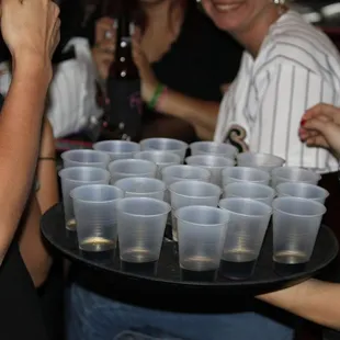 a tray full of plastic cups