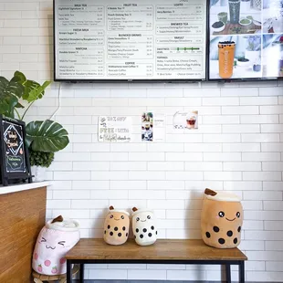 eightfold menu and interior + the boba plushies i brought making friends with the larger resident plushies haha