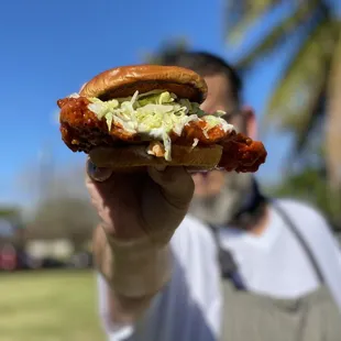 a man holding a hot dog