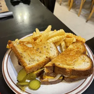a grilled cheese sandwich and fries