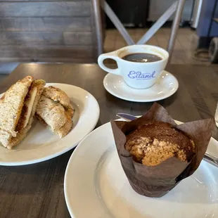 Breakfast sandwich, mixed berry muffin and a cup Americano coffee.
