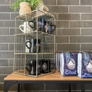 Mugs and coffee beans for sale. Nice decor.