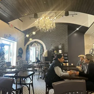 Inside - dark paint and wood, glam lighting, cozy leather booths