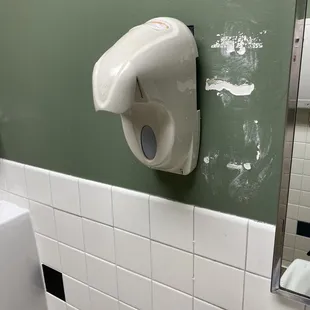 a bathroom with green walls