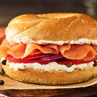 a bagel sandwich with cream cheese and salmon