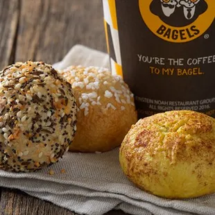 ows a cup of coffee and three doughnuts