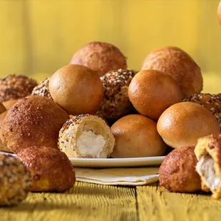 a pile of bagels on a plate