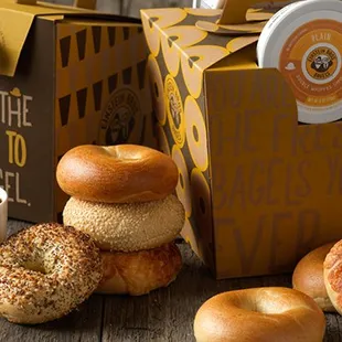 a variety of bagels and a cup of coffee