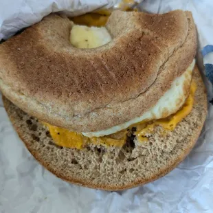 Egg cheese and sausage on a disgusting whole wheat bagel.