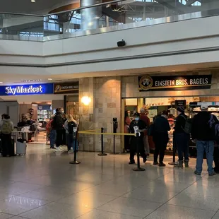 Einstein Bagels is located in the central area for all C gates, between SkyMarket and Timberline.