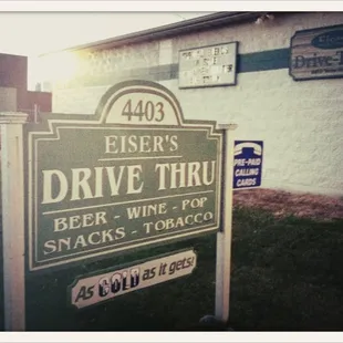 a sign in front of a building