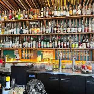 a bar with many bottles of alcohol