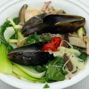 Ejenmyun with Seafood: $15. Take-out. Lost most of the broth because container cover had an inadequate seal.