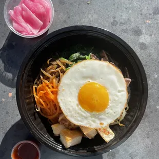 Bibimbap Rice Bowl with tofu, white rice, carrots, shiitake mushroom, spinach, burdock root, &amp; sweet / sour sauce