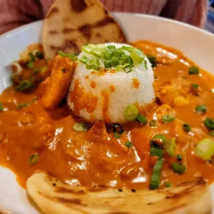 a plate of food with rice and vegetables
