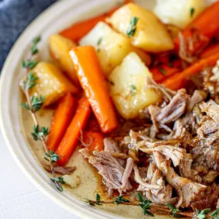 a plate of roast and vegetables