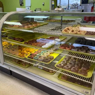 a display case filled with donuts