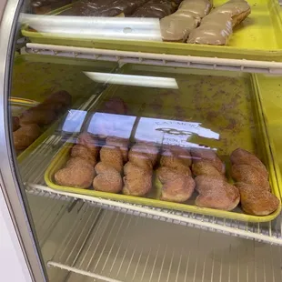 a display case filled with donuts
