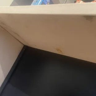 Under part of waterfall and underneath counter top