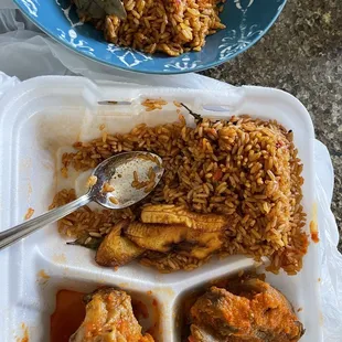 A serving of jollof rice, add chicken and added goat.  The plantain is an extra serving too.  Did not receive even 1/4 of a plantain.