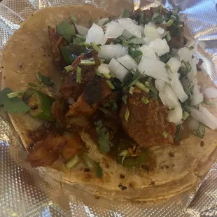 Pastor taco with grilled jalapeños