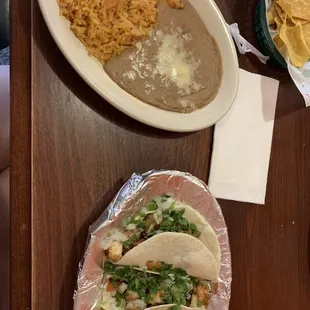 Shrimp tacos with rice and beans