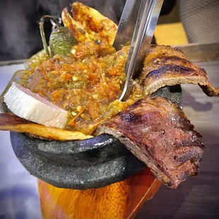 Molcajete for one! But it's can feed two! It's such a large portion! Don't let the picture fool you! The sauce is to die for!
