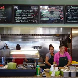 The tiny, and I mean very tiny indoor dining room - with two small tables - is dominated by the counter, the kitchen, and the menu.