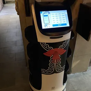 robot that serves chips and salsa to all of the tables