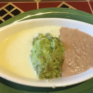Trio dip: cheese, guacamole, beans.