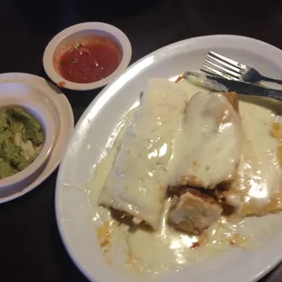 #15 meal, chicken burrito, tamale, and cheese enchilada with cheese sauce.  Salsa is always on point