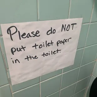 a sign in a public restroom