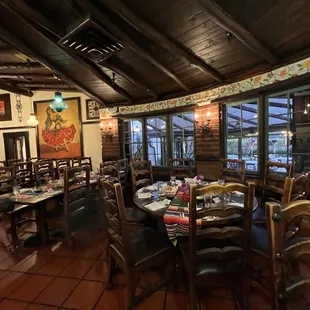 a dining room with tables and chairs