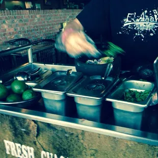 Come to table and made guacamole dip in front of you.