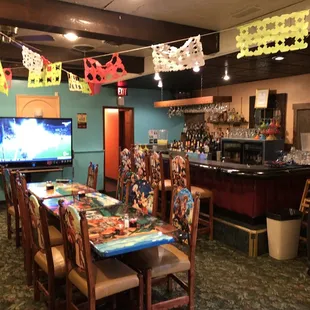 a dining room with tables and chairs