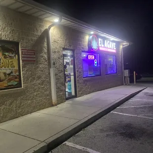 a neon sign on the side of a building