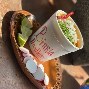 a paper cup with a straw