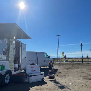 a food truck parked on the side of the road