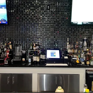 a bar with a lot of bottles